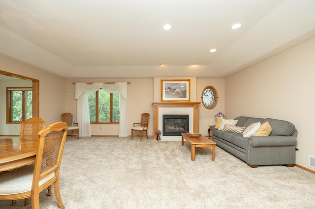 508 Woodside Ct, Shakopee, MN 55379 - living area featuring light carpet, healthy amount of natural light, a glass covered fireplace, and recessed lighting