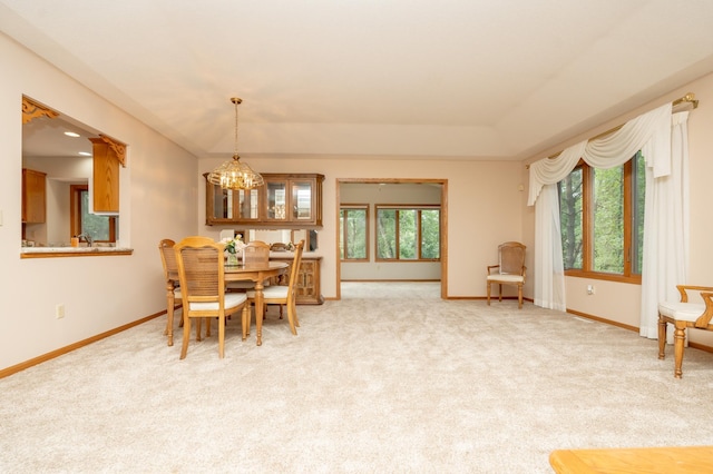 508 Woodside Ct, Shakopee, MN 55379 - dining area with a chandelier and light colored carpet
