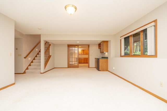 508 Woodside Ct, Shakopee, MN 55379 - unfurnished living room with stairway, light carpet, and wet bar