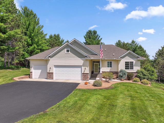 13725 Maxwell Rd, Chisago Lake Twp, MN 55013 - view of front of property with asphalt driveway, an attached garage, a front lawn, and stone siding