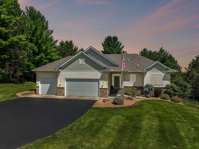 13725 Maxwell Rd, Chisago Lake Twp, MN 55013 - view of front of house with asphalt driveway, an attached garage, a front lawn, and stone siding