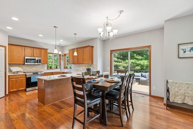 13725 Maxwell Rd, Chisago Lake Twp, MN 55013 - dining space with hardwood / wood-style floors, recessed lighting, and a chandelier