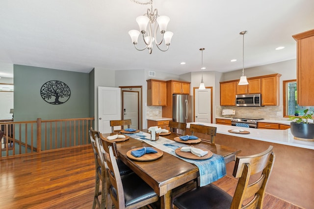 13725 Maxwell Rd, Chisago Lake Twp, MN 55013 - dining space with dark wood finished floors, a chandelier, and recessed lighting