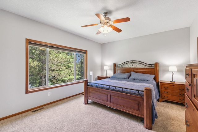 13725 Maxwell Rd, Chisago Lake Twp, MN 55013 - bedroom with light colored carpet and a ceiling fan