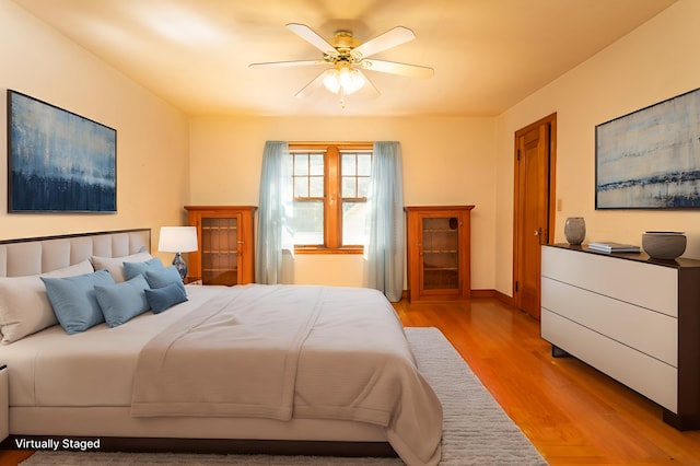 210 1st Ave SW, Glenwood, MN 56334 - bedroom featuring light wood finished floors and a ceiling fan