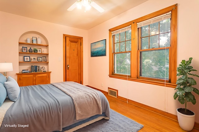 210 1st Ave SW, Glenwood, MN 56334 - bedroom featuring wood finished floors and a ceiling fan
