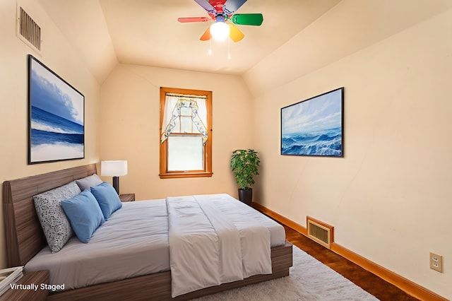 210 1st Ave SW, Glenwood, MN 56334 - bedroom with vaulted ceiling, wood finished floors, and a ceiling fan