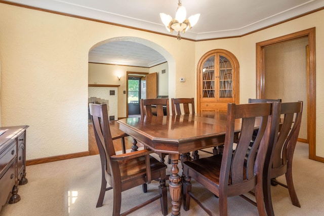210 1st Ave SW, Glenwood, MN 56334 - dining area with arched walkways, light carpet, crown molding, a chandelier, and a textured wall