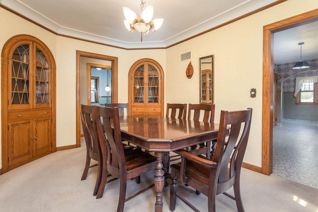 210 1st Ave SW, Glenwood, MN 56334 - dining area featuring a chandelier, light carpet, and crown molding