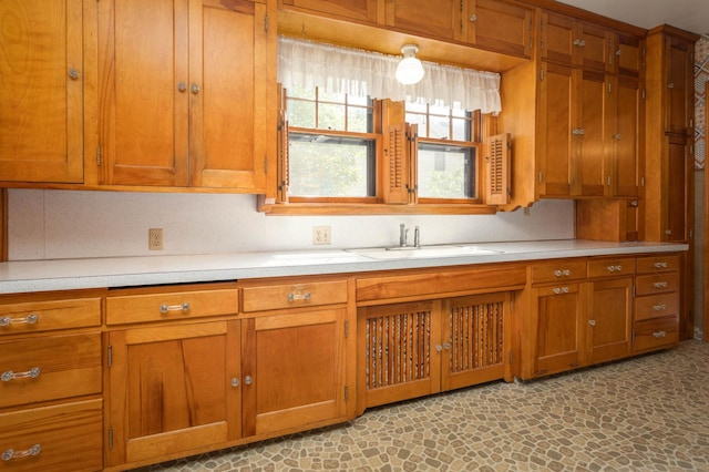 210 1st Ave SW, Glenwood, MN 56334 - kitchen with brown cabinetry and light countertops