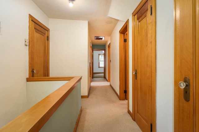 210 1st Ave SW, Glenwood, MN 56334 - corridor featuring light carpet and an upstairs landing