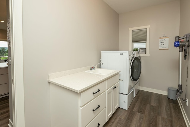1427 Amco Dr SE, Chatfield, MN 55923 - washroom featuring washer and clothes dryer, dark wood-style floors, and cabinet space
