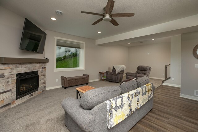 1427 Amco Dr SE, Chatfield, MN 55923 - living area featuring a ceiling fan, a fireplace, recessed lighting, and a textured ceiling