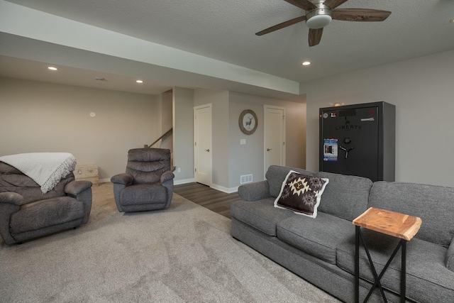 1427 Amco Dr SE, Chatfield, MN 55923 - carpeted living room with recessed lighting, ceiling fan, wood finished floors, and stairway