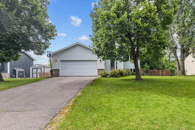 6882 173rd St W Unit 173, Lakeville, MN 55024 - view of front facade with brick siding, asphalt driveway, and an outbuilding