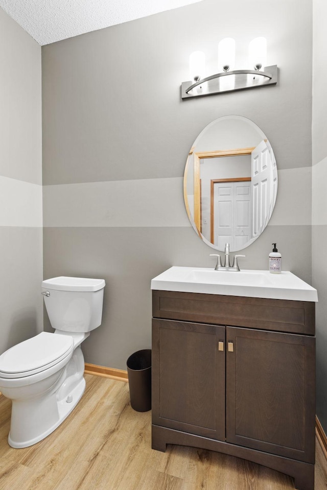8479 Forestview Ln N, Maple Grove, MN 55369 - bathroom featuring wood finished floors and vanity