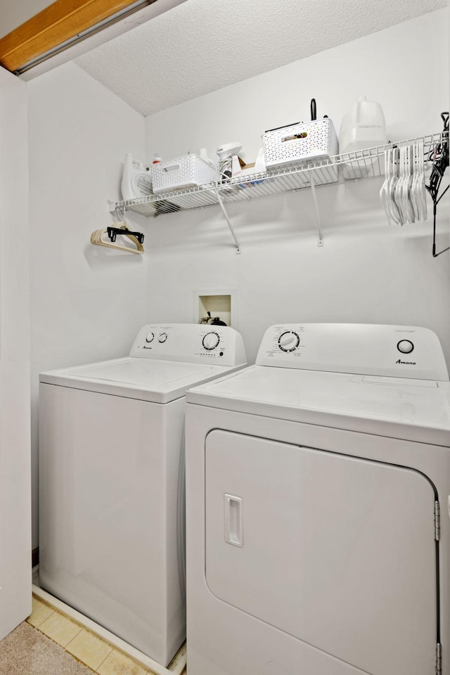 8479 Forestview Ln N, Maple Grove, MN 55369 - washroom featuring washer and dryer and light tile patterned floors
