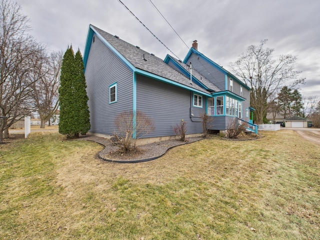 905 3rd Ave SW, Pine City, MN 55063 - back of property with a chimney, a yard, and roof with shingles