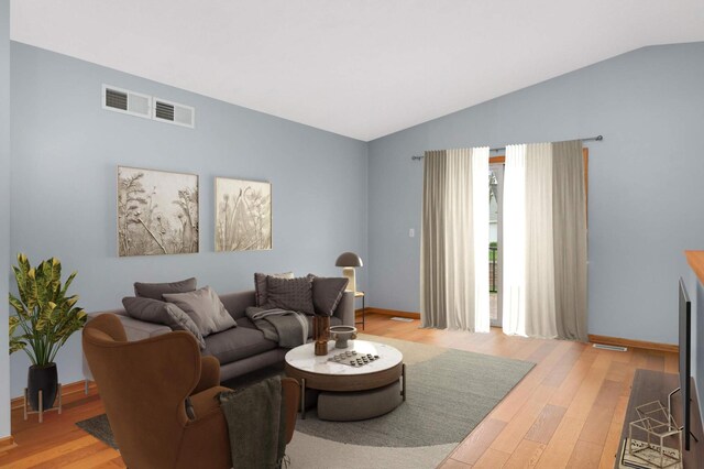 1110 Lilac Ct, Waconia, MN 55387 - living room with vaulted ceiling and light wood-style flooring