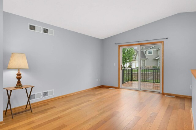 1110 Lilac Ct, Waconia, MN 55387 - spare room with light wood finished floors and lofted ceiling