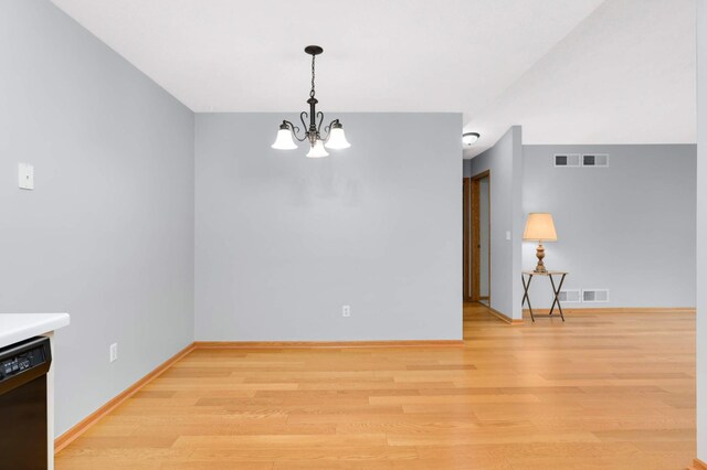 1110 Lilac Ct, Waconia, MN 55387 - unfurnished room with a chandelier and light wood-style floors