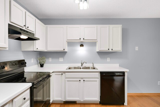 1110 Lilac Ct, Waconia, MN 55387 - kitchen featuring black appliances, under cabinet range hood, white cabinets, and light wood finished floors