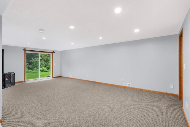 1110 Lilac Ct, Waconia, MN 55387 - empty room with carpet floors, recessed lighting, and a smoke detector