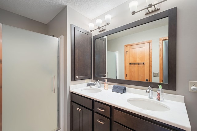 8772 Benson Way Unit 81, Inver Grove Heights, MN 55076 - full bathroom with double vanity, a stall shower, and a textured ceiling