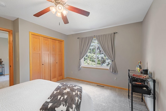 8772 Benson Way Unit 81, Inver Grove Heights, MN 55076 - bedroom with light carpet, a closet, ceiling fan, and a textured ceiling