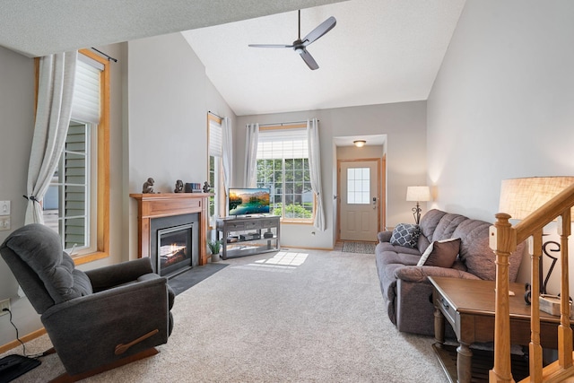 8772 Benson Way Unit 81, Inver Grove Heights, MN 55076 - carpeted living area with lofted ceiling, a ceiling fan, and a fireplace with flush hearth