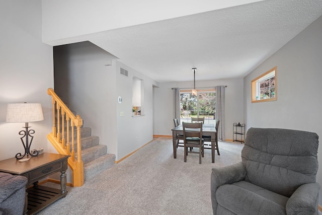8772 Benson Way Unit 81, Inver Grove Heights, MN 55076 - dining room featuring light carpet, stairs, and a textured ceiling