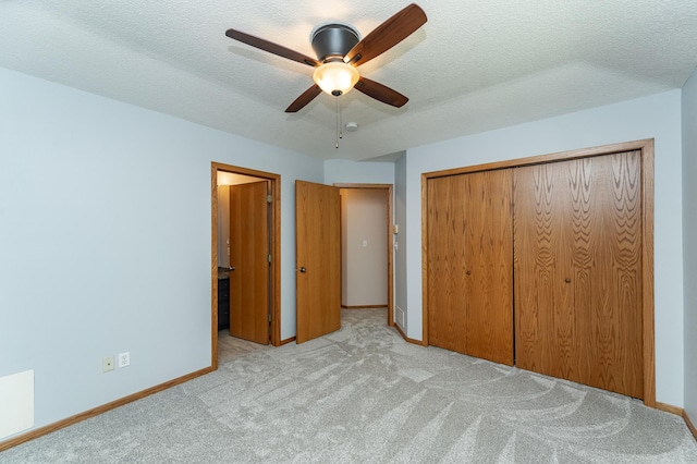 816 Bristol Ln NE, Rochester, MN 55906 - unfurnished bedroom featuring carpet flooring, a closet, a textured ceiling, and ceiling fan