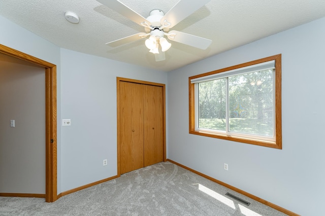 816 Bristol Ln NE, Rochester, MN 55906 - unfurnished bedroom with a closet, light carpet, and a ceiling fan