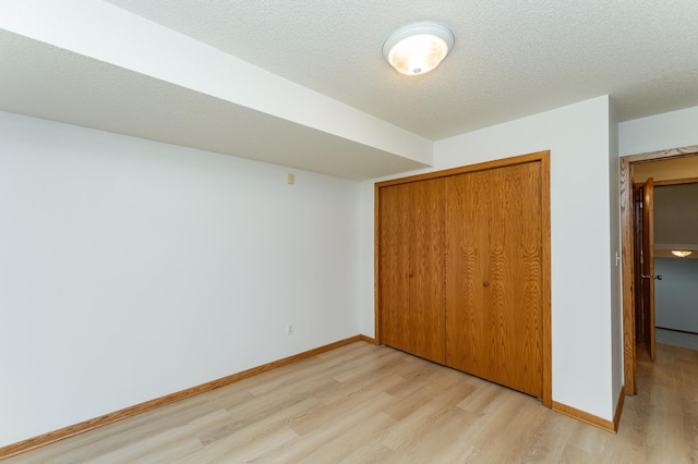 816 Bristol Ln NE, Rochester, MN 55906 - unfurnished bedroom with light wood-style flooring and a closet