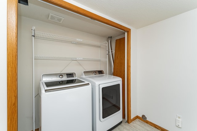 816 Bristol Ln NE, Rochester, MN 55906 - washroom featuring separate washer and dryer and baseboards