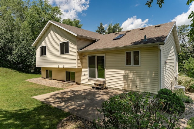 816 Bristol Ln NE, Rochester, MN 55906 - rear view of house with a yard, entry steps, roof with shingles, and a patio