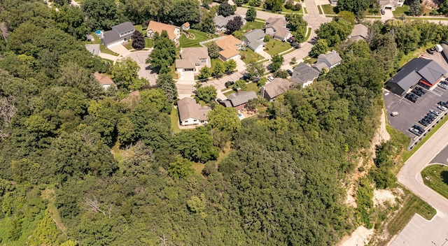 816 Bristol Ln NE, Rochester, MN 55906 - aerial view of property and surrounding area with nearby suburban area and a heavily wooded area