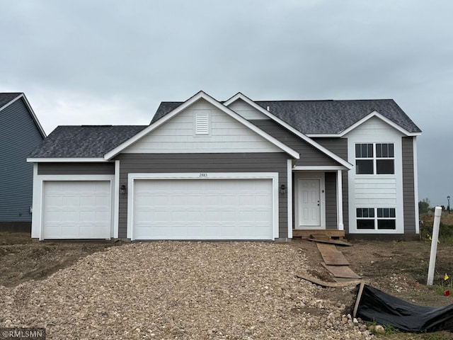 2883 Ivory Ave NE, Saint Michael, MN 55376 - view of front of home with an attached garage, roof with shingles, and driveway
