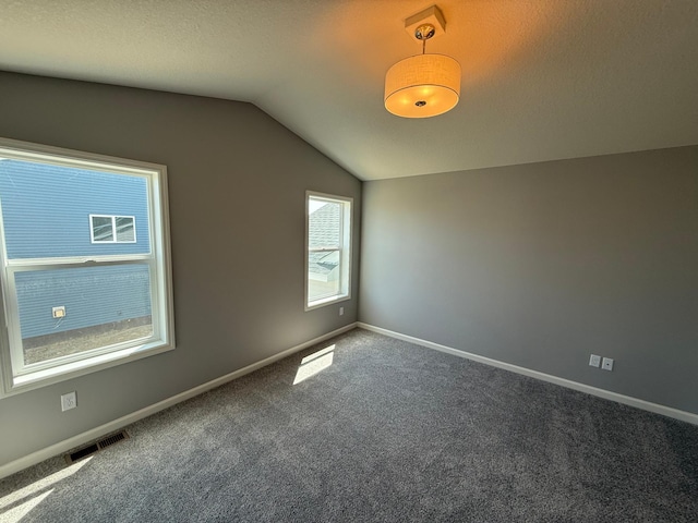 2883 Ivory Ave NE, Saint Michael, MN 55376 - carpeted spare room featuring vaulted ceiling and baseboards