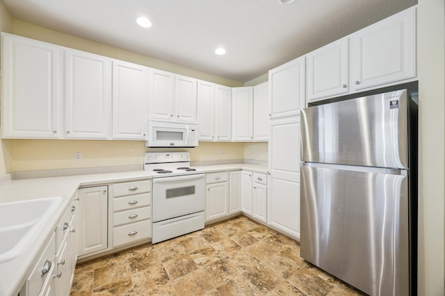 14000 Erwin Ct, Eden Prairie, MN 55344 - kitchen featuring white appliances, stone finish flooring, white cabinetry, recessed lighting, and light countertops