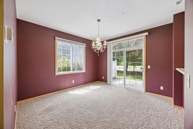 14000 Erwin Ct, Eden Prairie, MN 55344 - carpeted spare room featuring a chandelier, plenty of natural light, and a textured ceiling