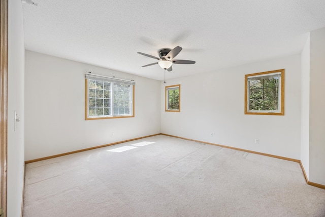14000 Erwin Ct, Eden Prairie, MN 55344 - empty room with light colored carpet, ceiling fan, and a textured ceiling