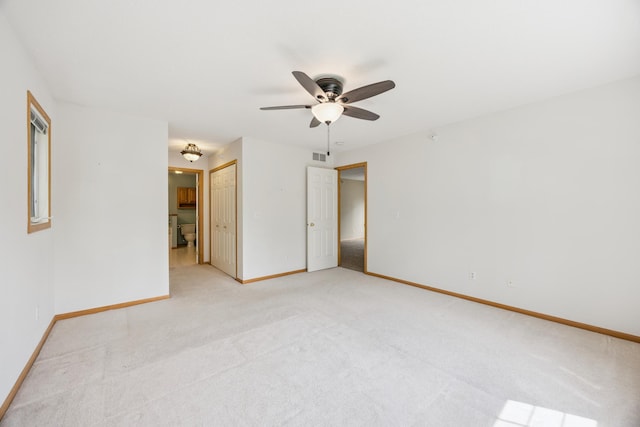 14000 Erwin Ct, Eden Prairie, MN 55344 - unfurnished bedroom with light colored carpet, ensuite bathroom, ceiling fan, and a closet