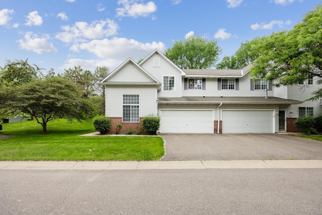 14000 Erwin Ct, Eden Prairie, MN 55344 - view of front of property with brick siding, asphalt driveway, an attached garage, and a front lawn