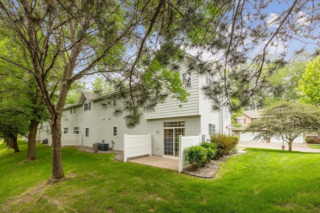 14000 Erwin Ct, Eden Prairie, MN 55344 - back of house featuring a lawn and a patio area