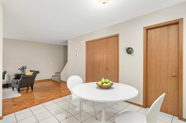 5960 Fernwood St, Shoreview, MN 55126 - dining area with stairway and a textured ceiling