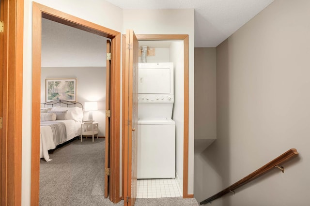 5960 Fernwood St, Shoreview, MN 55126 - laundry area with estacked washer and dryer and carpet floors