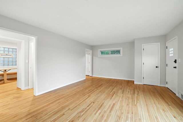 188 Cleveland Ave S, Saint Paul, MN 55105 - unfurnished living room featuring light wood-type flooring and baseboards