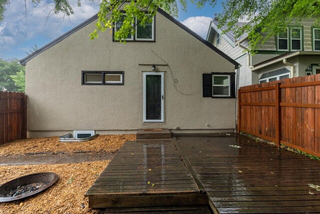 188 Cleveland Ave S, Saint Paul, MN 55105 - back of house featuring stucco siding and a wooden deck