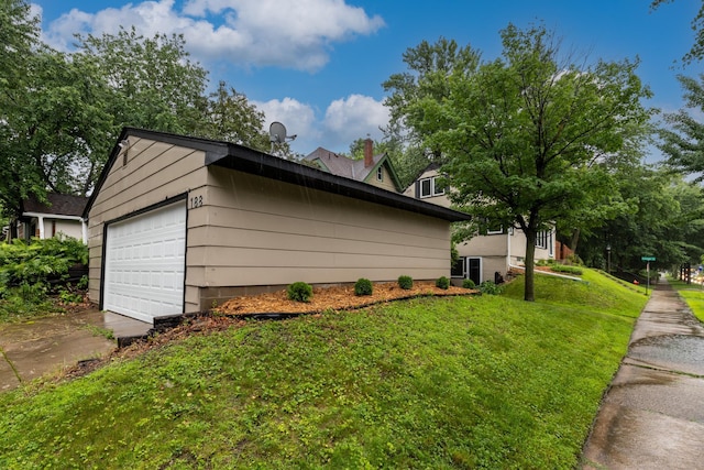188 Cleveland Ave S, Saint Paul, MN 55105 - view of side of property featuring a lawn and a garage